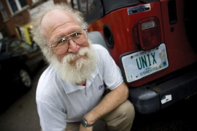 Jon Hall and his Jeep Wrangler showing a license plate that reads 'UNIX'